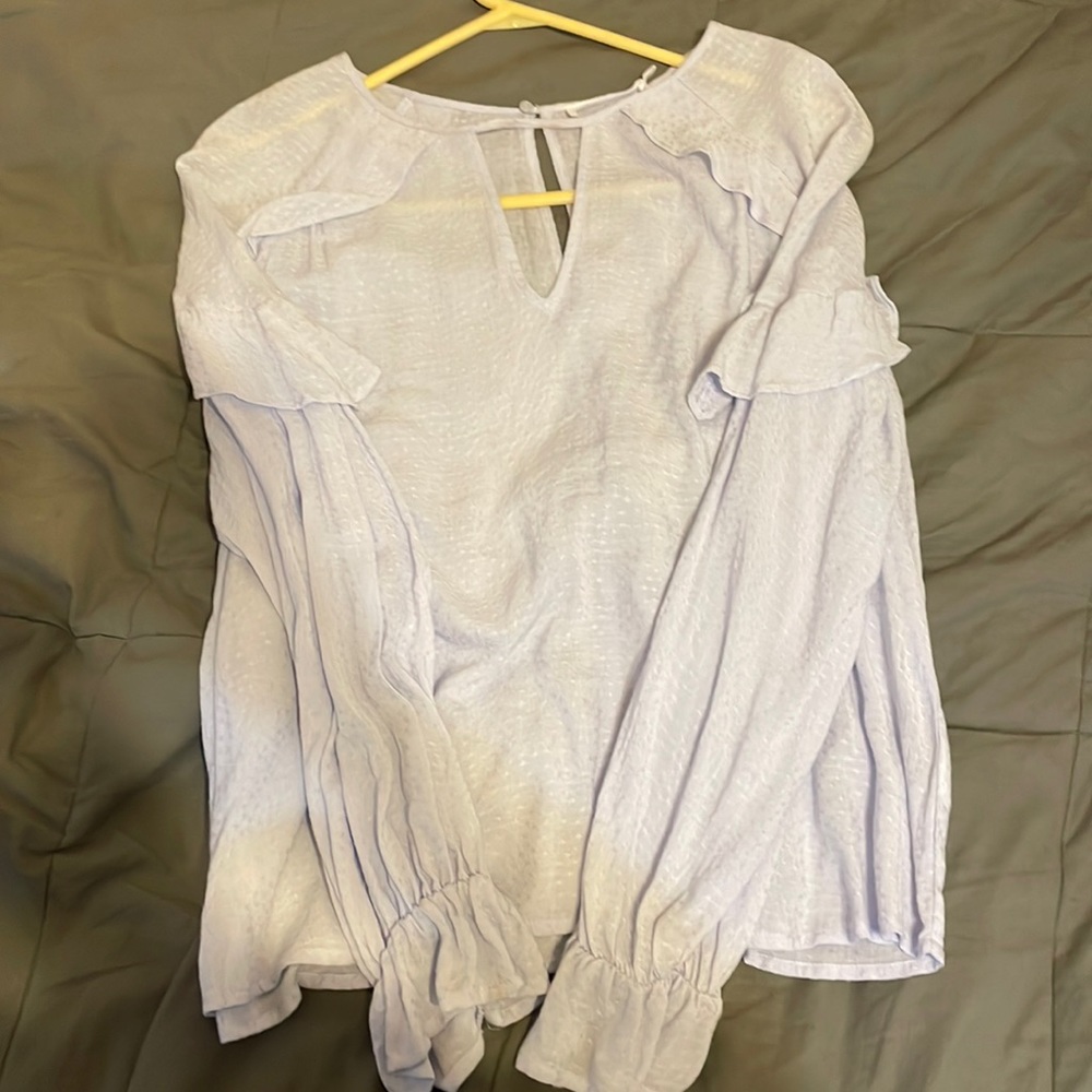 Light blue blouse.